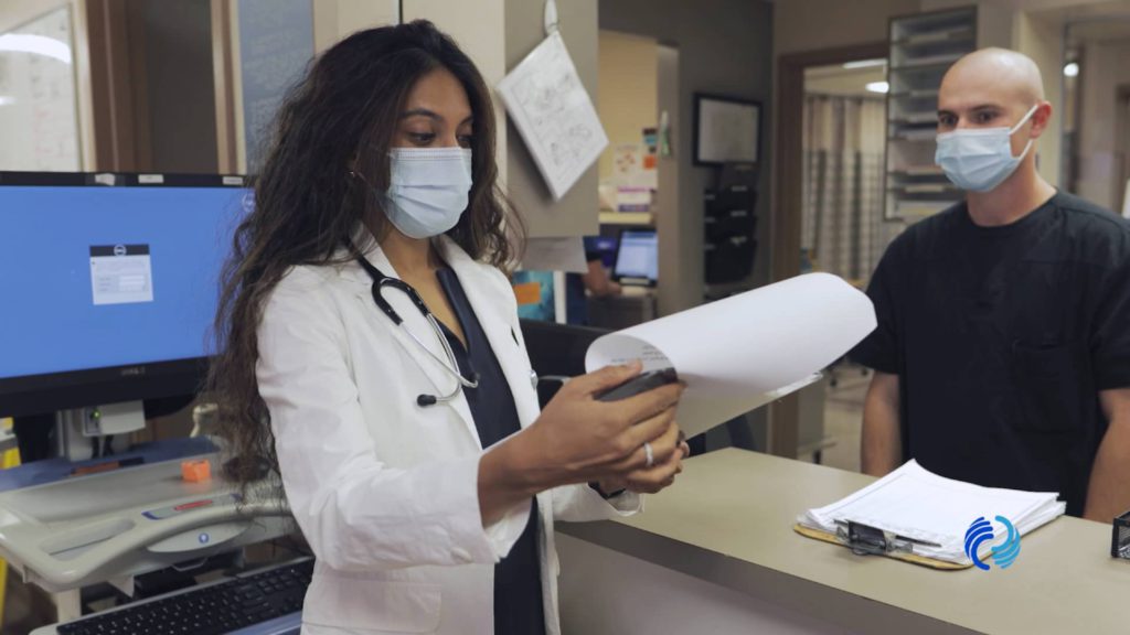 Promisecare Medical Group -         Description: A woman and a man wearing face masks during Open Enrollment 2022.