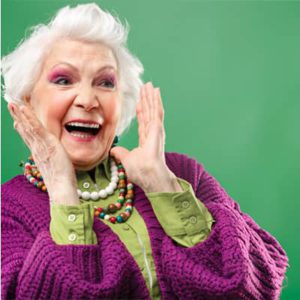 Promisecare Medical Group - During the Medicare Annual Enrollment Period, a woman wearing a purple sweater calmly holds her hands up in an expressive gesture.